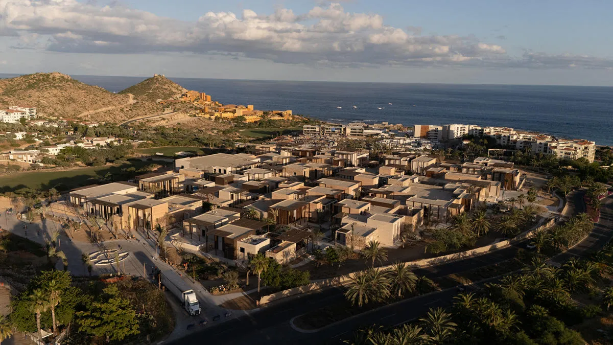 High-altitude aerial perspective of the modern architectural layout and premier infrastructure at Anima Village in Cabo del Sol.