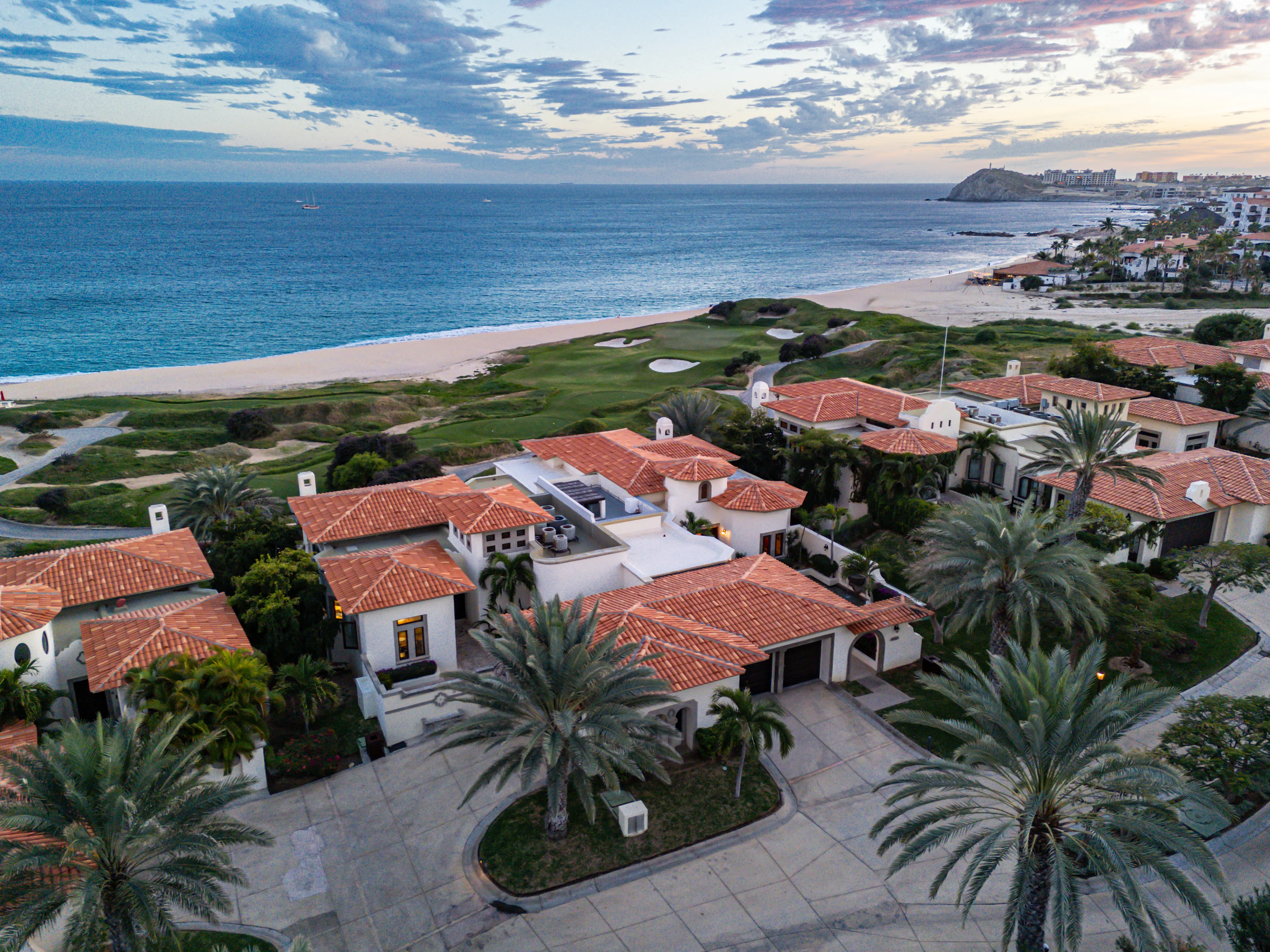 Stunning architectural exterior of an ultra-exclusive custom beachfront luxury villa facing the Sea of Cortez in Cabo del Sol.