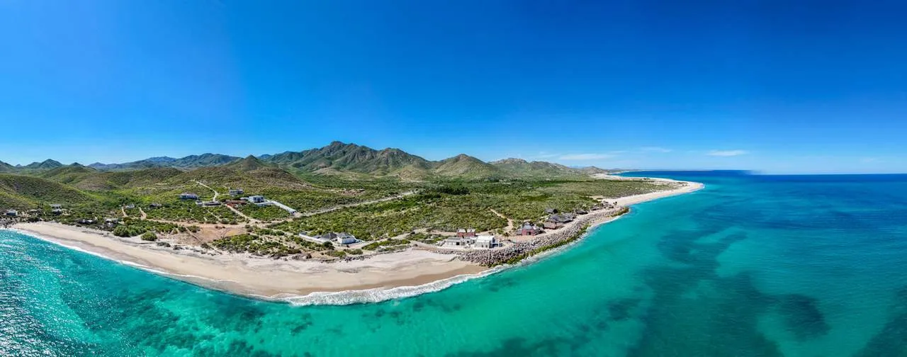 Breathtaking panoramic aerial view of the pristine turquoise waters and protected coastline of Cabo Pulmo National Marine Park on the East Cape of the Sea of Cortez.