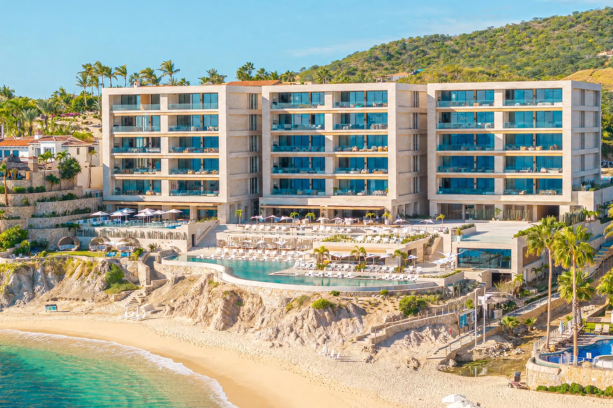High-end beachfront condo residences at the private Querencia Beach Club, offering direct oceanfront access and unobstructed Sea of Cortez views.