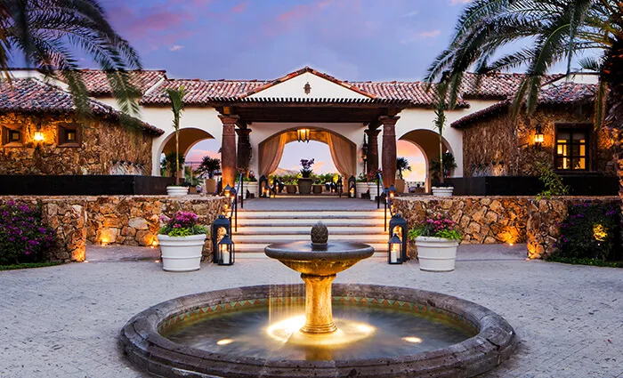Architectural exterior facade of a multi-million dollar custom luxury estate villa combining modern and traditional Mexican design elements in Querencia Los Cabos.
