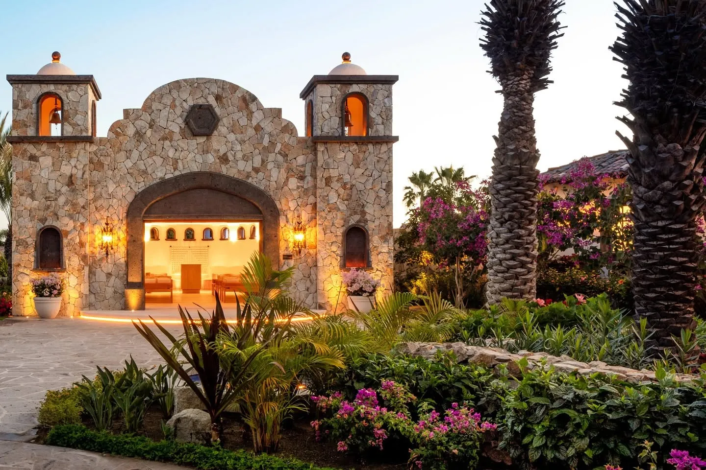 Panoramic elevated overview of the ultra-exclusive Querencia gated community in Los Cabos, showcasing luxury villas nestled into the desert hillsides overlooking the Sea of Cortez.