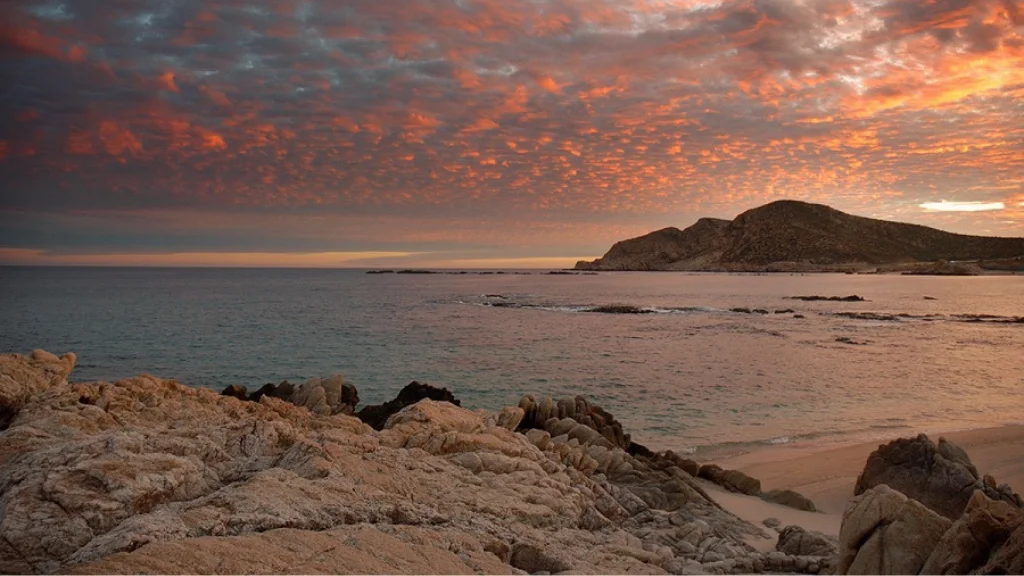 A sunset on the Chileno Bay's beach