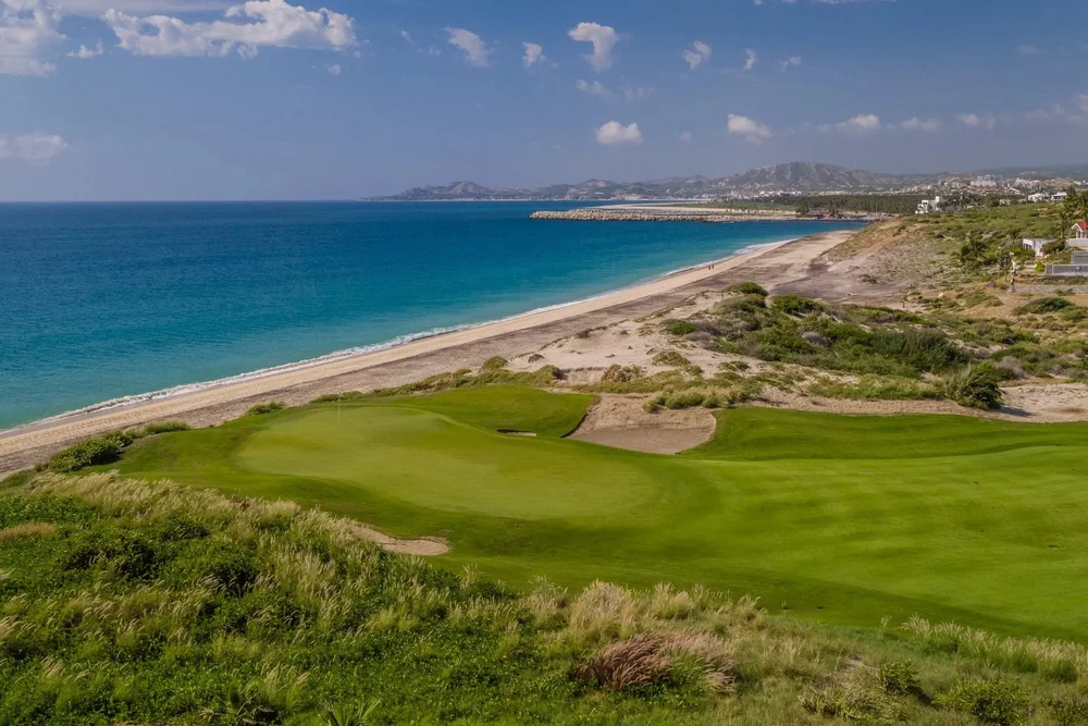 Luxury beachfront golf green at Puerto Los Cabos located directly along the shore of the Sea of Cortez.